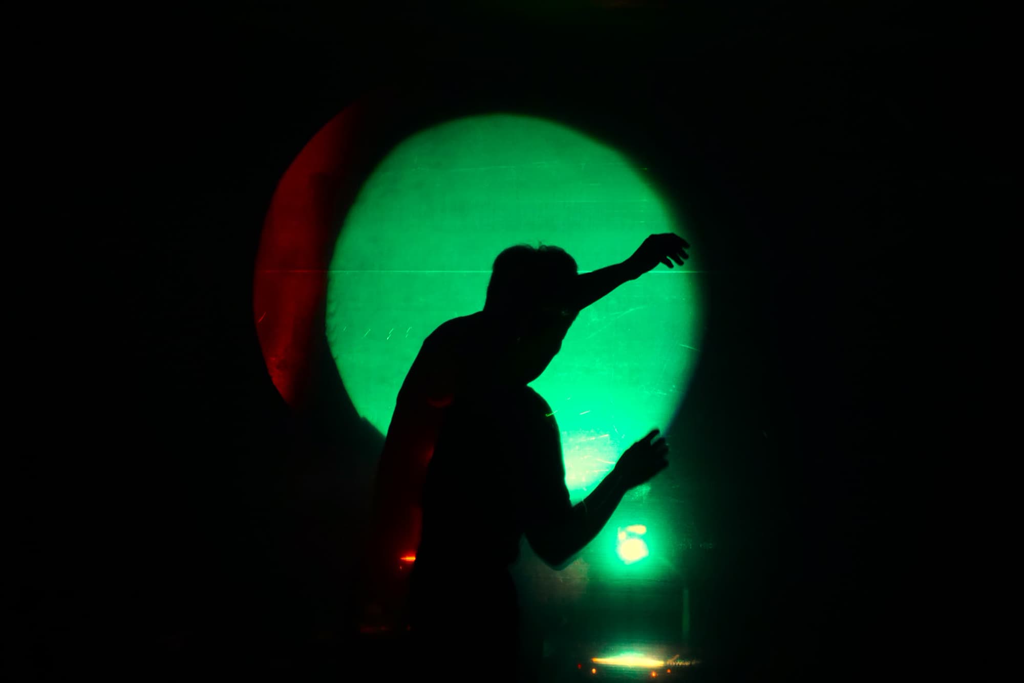 Musician at a mixing table during the performance, Em.Pressão