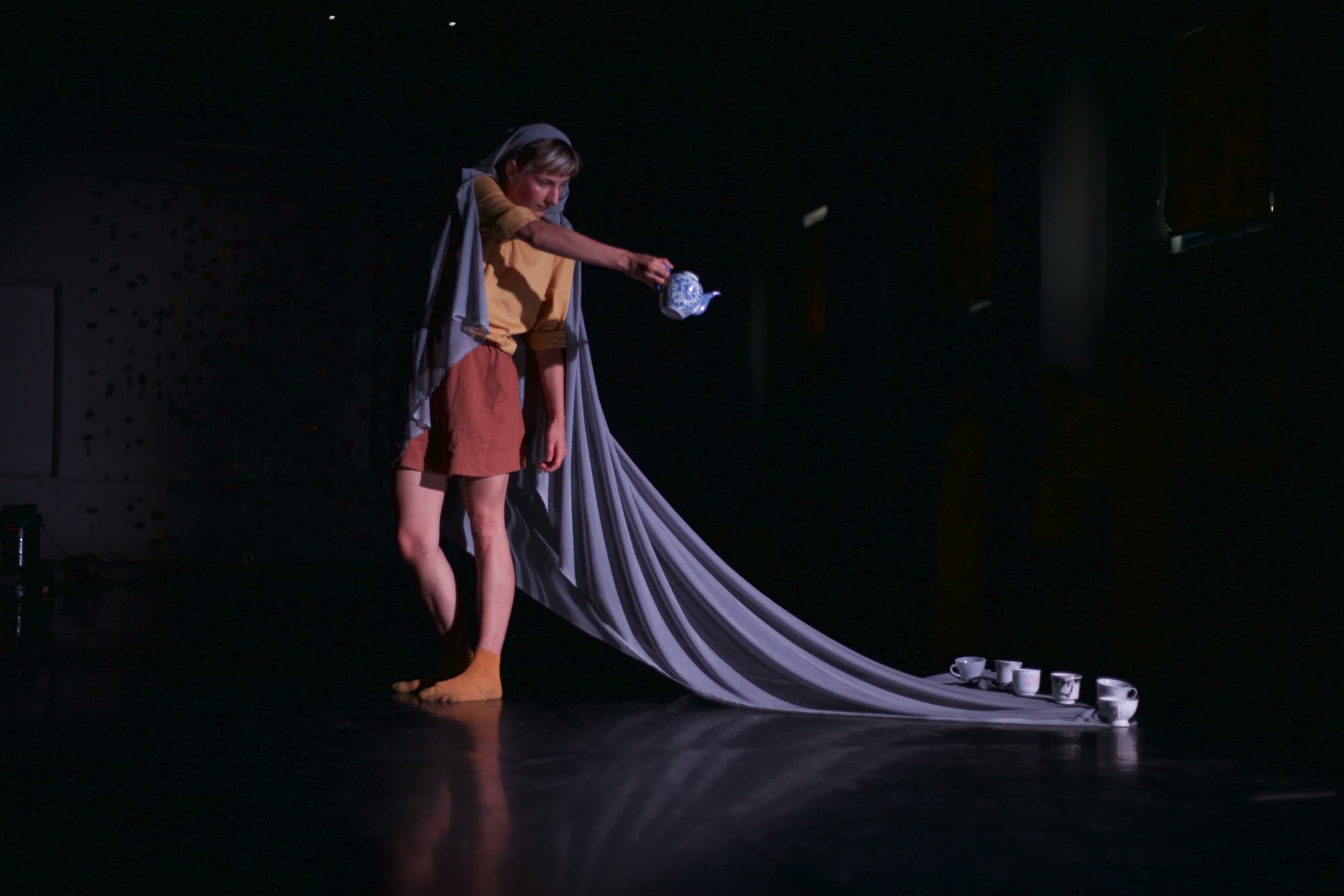 Two performers facing each other on a dark polka-dot stage, Sonata for Vacuum and H.strings
